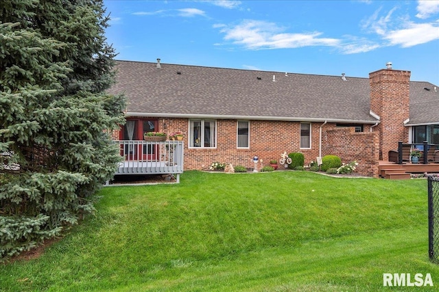 5001 Wildcat Run, Springfield, IL 62711 - back of house featuring roof with shingles, a deck, brick siding, a yard, and a chimney