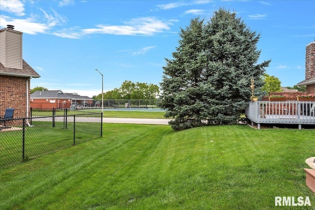 view of yard with tennis court