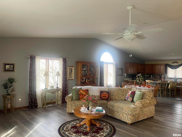 living room with hardwood / wood-style floors, ceiling fan, a healthy amount of sunlight, and lofted ceiling