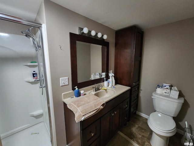 bathroom featuring walk in shower, toilet, and vanity