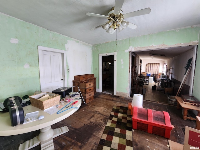 interior space featuring ceiling fan and hardwood / wood-style flooring