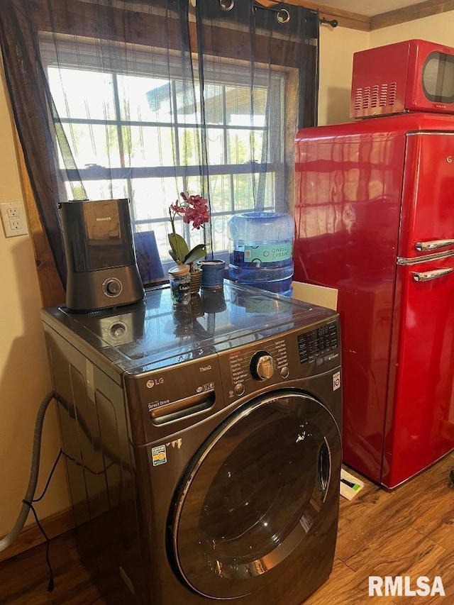 laundry room with washer / clothes dryer and hardwood / wood-style flooring