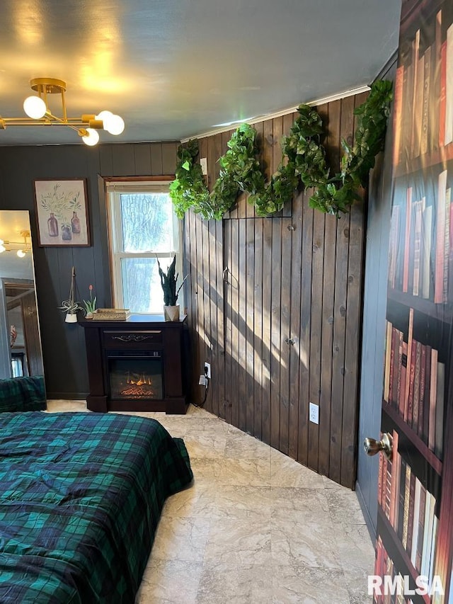 bedroom featuring tile patterned floors and wooden walls