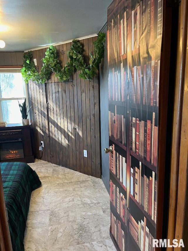 tiled bedroom featuring wood walls