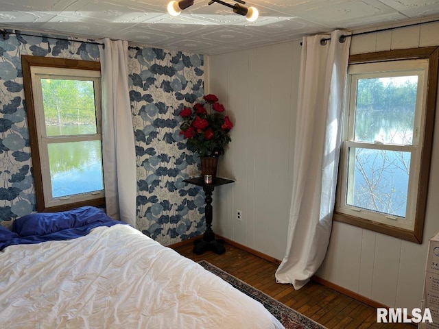 bedroom featuring dark wood-type flooring