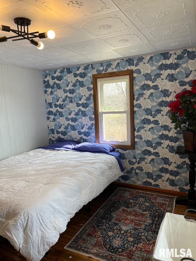 bedroom featuring hardwood / wood-style flooring and ceiling fan