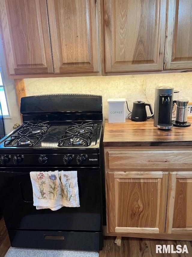 kitchen with black range with gas cooktop and butcher block counters