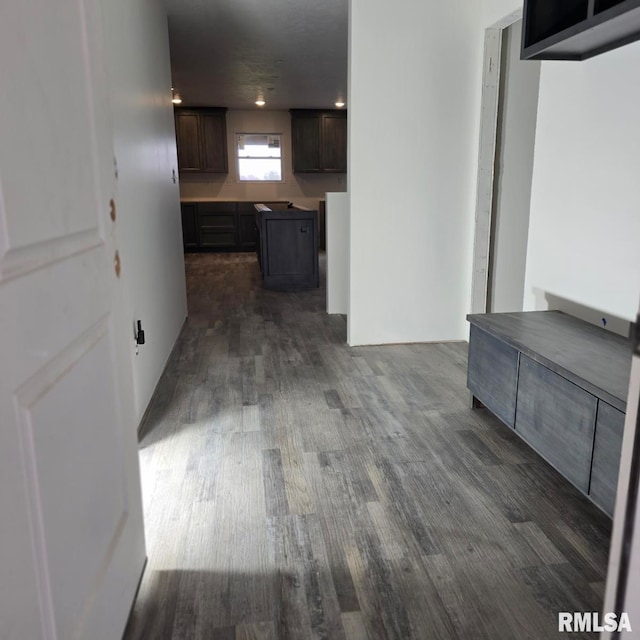 corridor with dark hardwood / wood-style floors