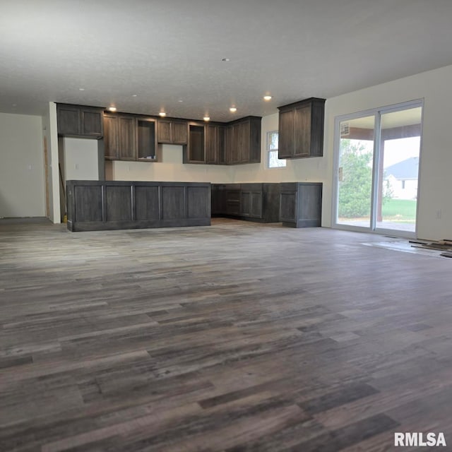 kitchen featuring dark brown cabinetry and hardwood / wood-style floors