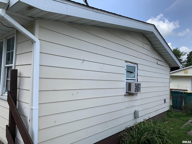 view of side of home featuring cooling unit