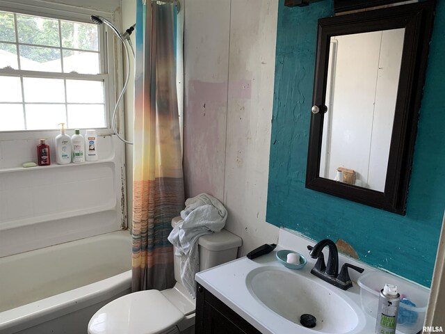 full bathroom with vanity, shower / bath combination with curtain, and toilet