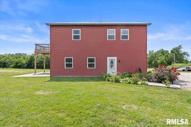 rear view of house with a lawn