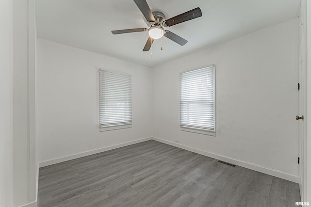 unfurnished room with hardwood / wood-style flooring and ceiling fan