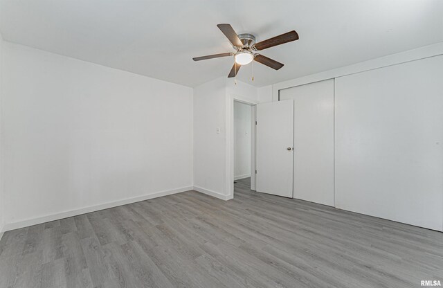 unfurnished bedroom with ceiling fan, light hardwood / wood-style floors, and a closet