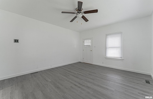 empty room featuring wood-type flooring and ceiling fan