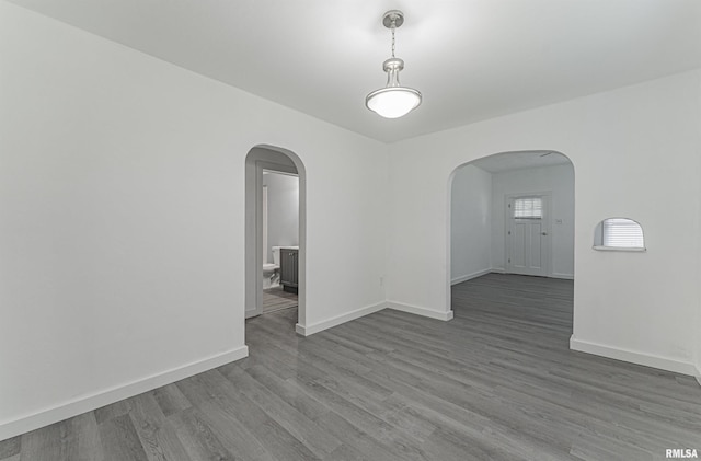 unfurnished room featuring hardwood / wood-style flooring