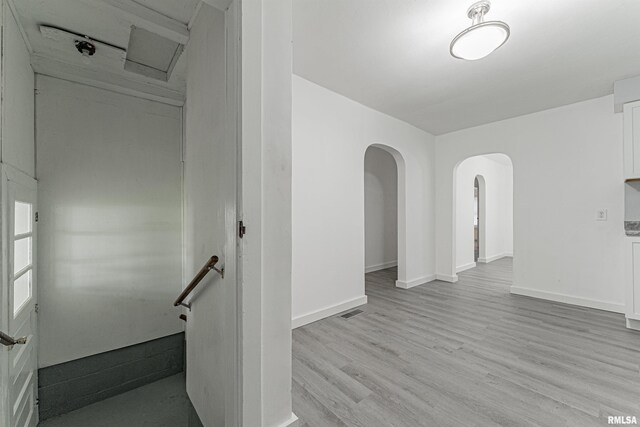 stairs featuring light hardwood / wood-style floors