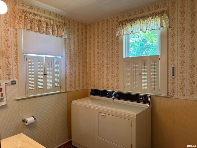 washroom with separate washer and dryer