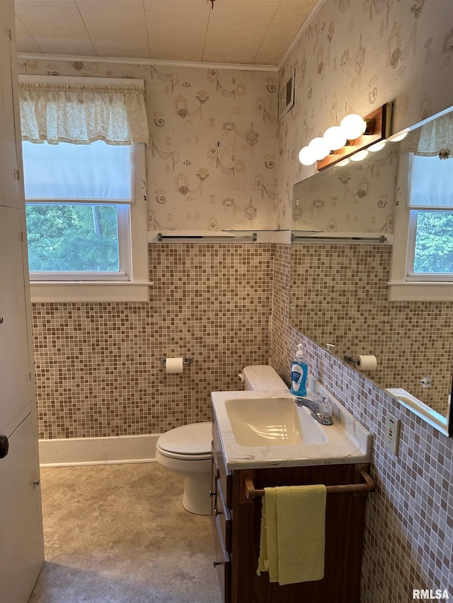 212 S Broadway St, Stronghurst, IL 61480 - bathroom featuring vanity, wallpapered walls, toilet, and wainscoting