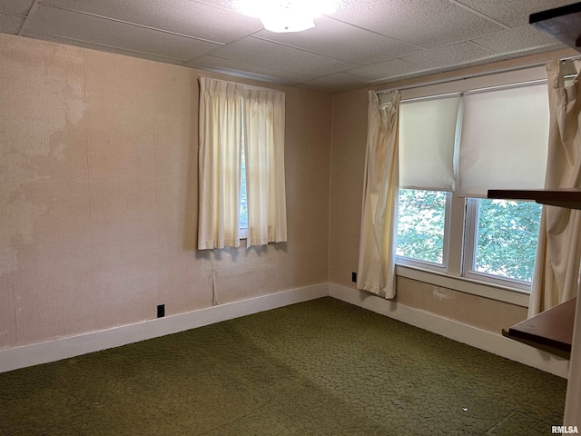 212 S Broadway St, Stronghurst, IL 61480 - empty room featuring baseboards and dark carpet