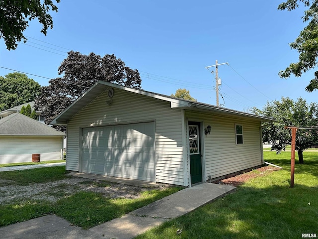 garage featuring a yard