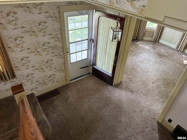 212 S Broadway St, Stronghurst, IL 61480 - doorway featuring baseboards, wallpapered walls, visible vents, and carpet