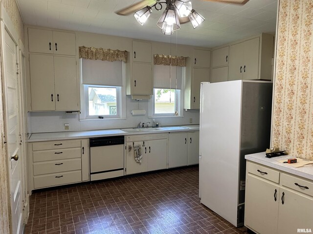 212 S Broadway St, Stronghurst, IL 61480 - kitchen with light countertops, white appliances, a sink, ceiling fan, and brick patterned floor