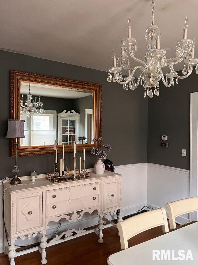 kitchen with white cabinets and a chandelier