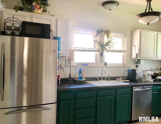 kitchen featuring sink, white cabinets, green cabinetry, and stainless steel appliances