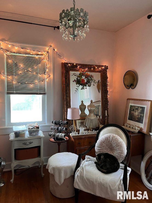 interior space featuring hardwood / wood-style flooring and a notable chandelier