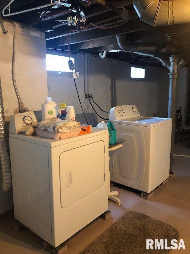 washroom with washing machine and clothes dryer