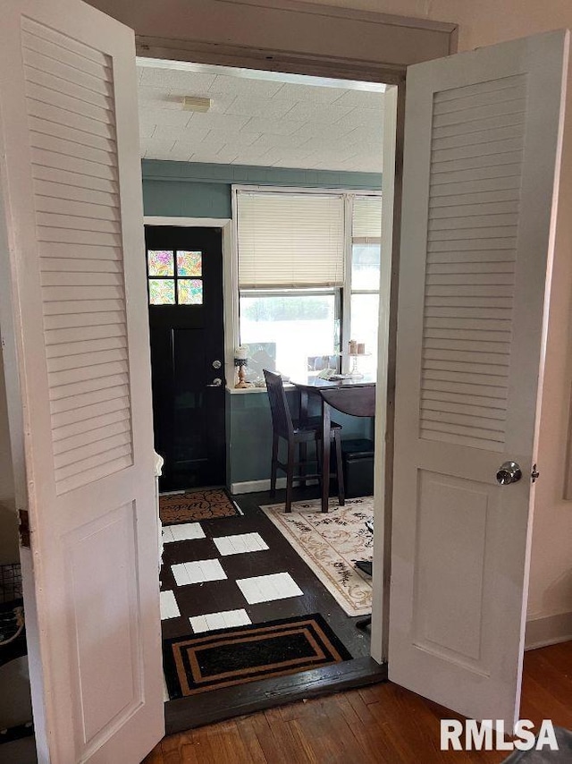 hallway featuring dark hardwood / wood-style floors