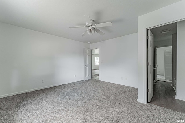 carpeted empty room with ceiling fan