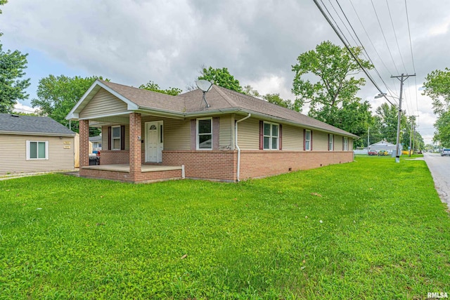 exterior space with a front yard and covered porch