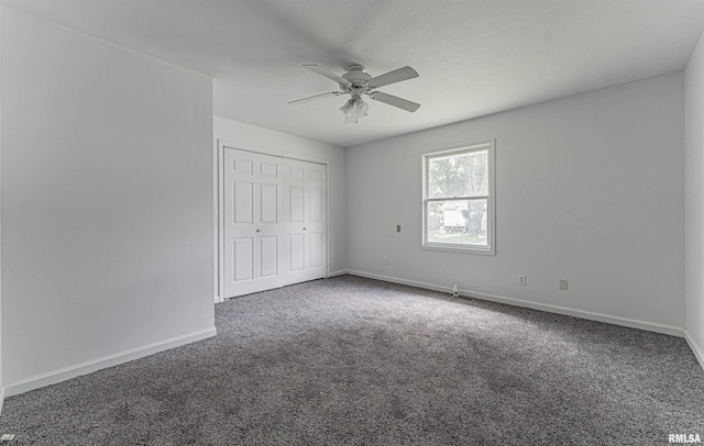 unfurnished bedroom with a closet, ceiling fan, and dark colored carpet