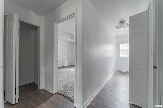 hall featuring dark wood-type flooring