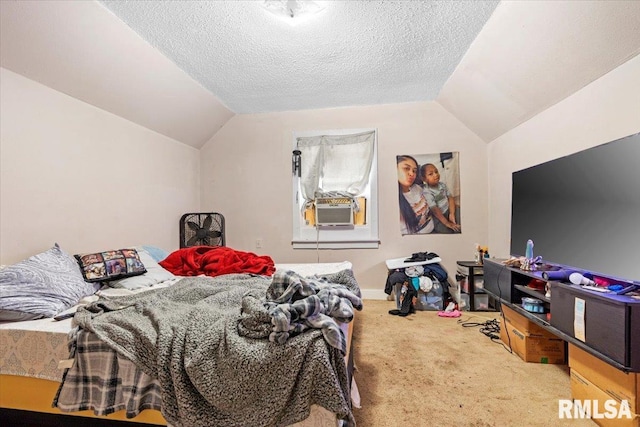 carpeted bedroom featuring lofted ceiling, cooling unit, and a textured ceiling