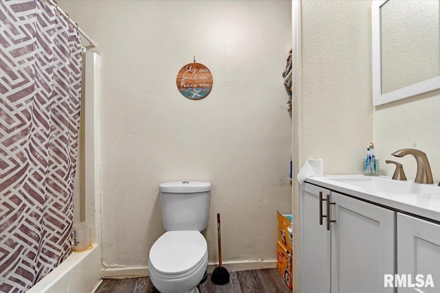 full bathroom with vanity, shower / bath combination with curtain, toilet, and wood-type flooring