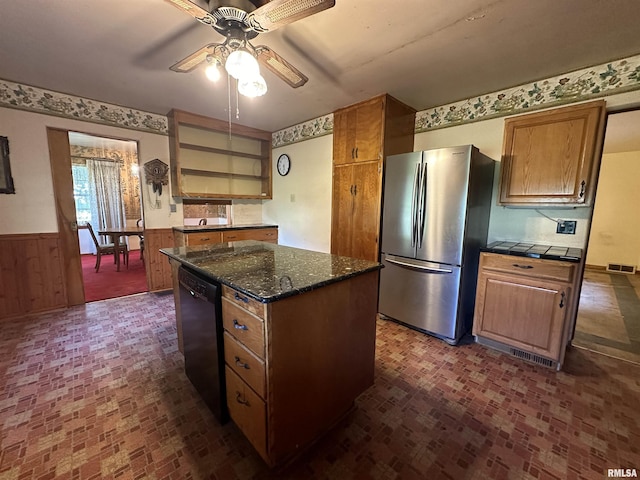 kitchen with visible vents, open shelves, freestanding refrigerator, black dishwasher, and wainscoting