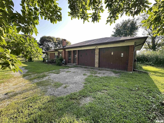 garage featuring driveway