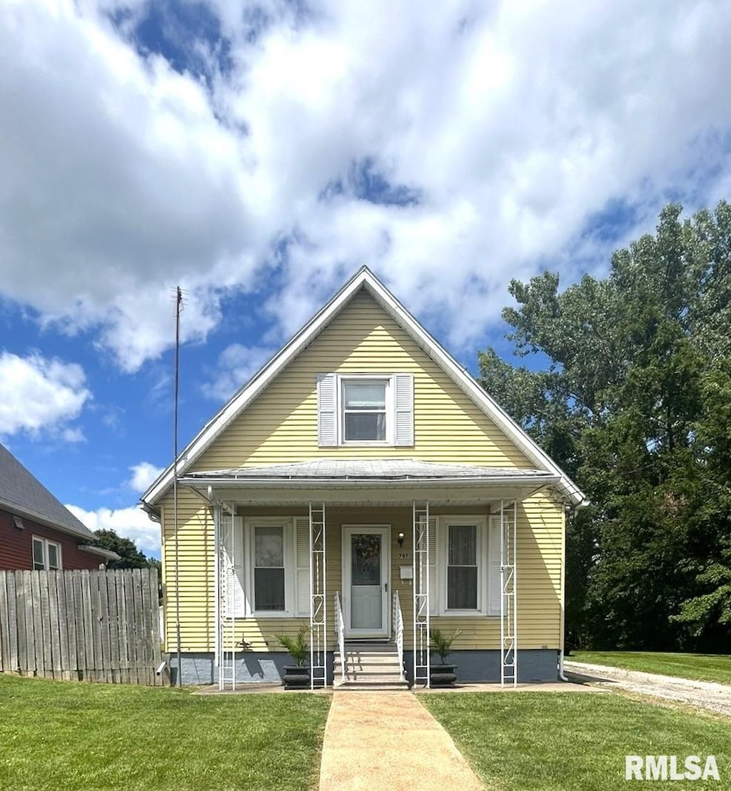 bungalow-style home with a porch and a front yard