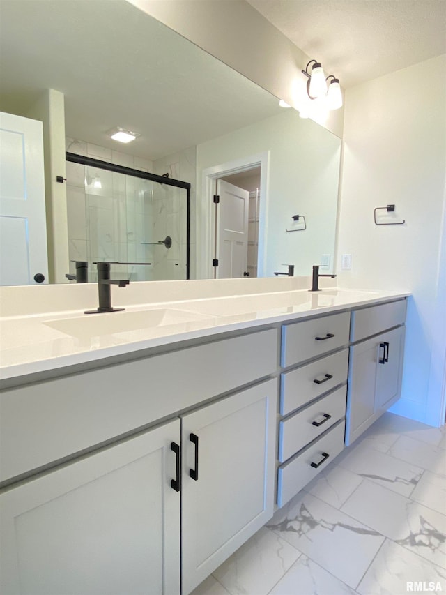 bathroom with vanity and an enclosed shower