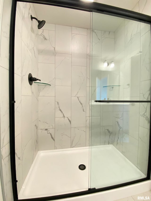 bathroom featuring an enclosed shower