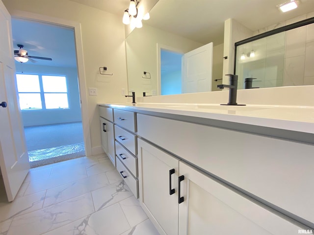 bathroom featuring vanity, ceiling fan, and a shower with door