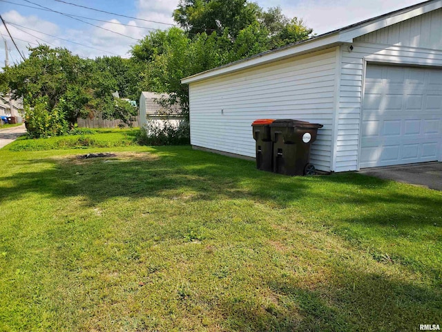 view of yard with a garage and an outdoor structure