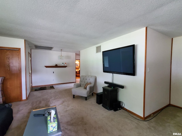 living room with carpet floors and a textured ceiling