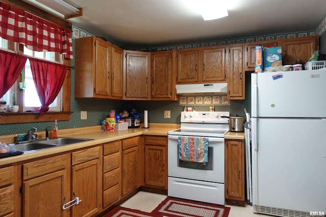 kitchen with white appliances and sink