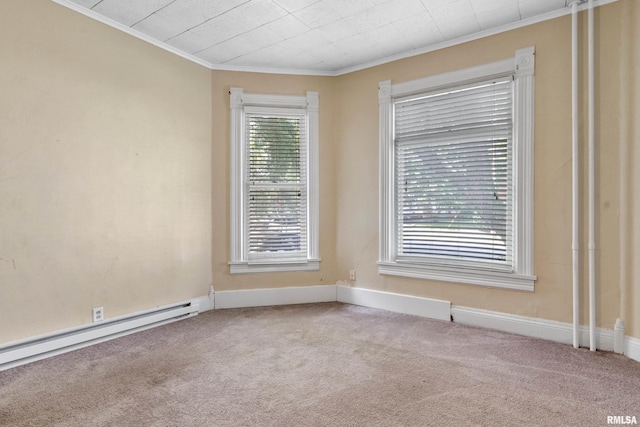 unfurnished room featuring carpet, baseboard heating, and crown molding