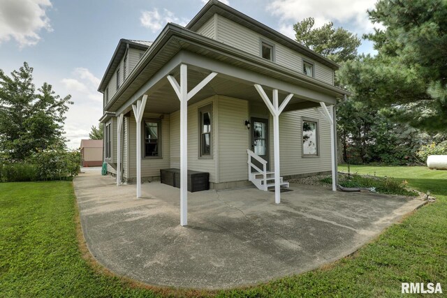 exterior space featuring a yard and entry steps