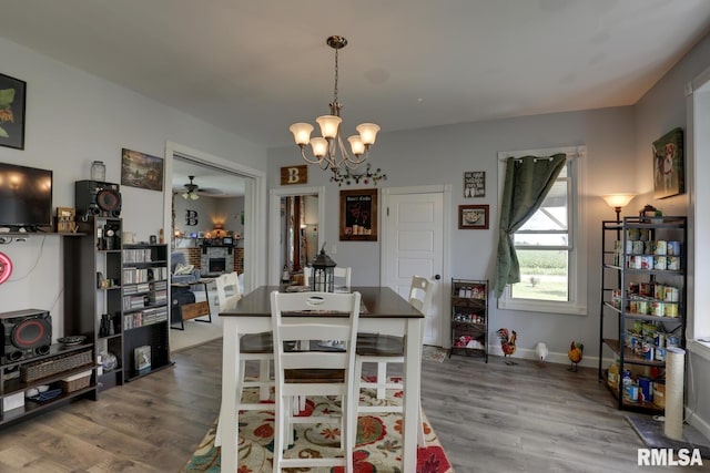 dining room with a notable chandelier and hardwood / wood-style flooring